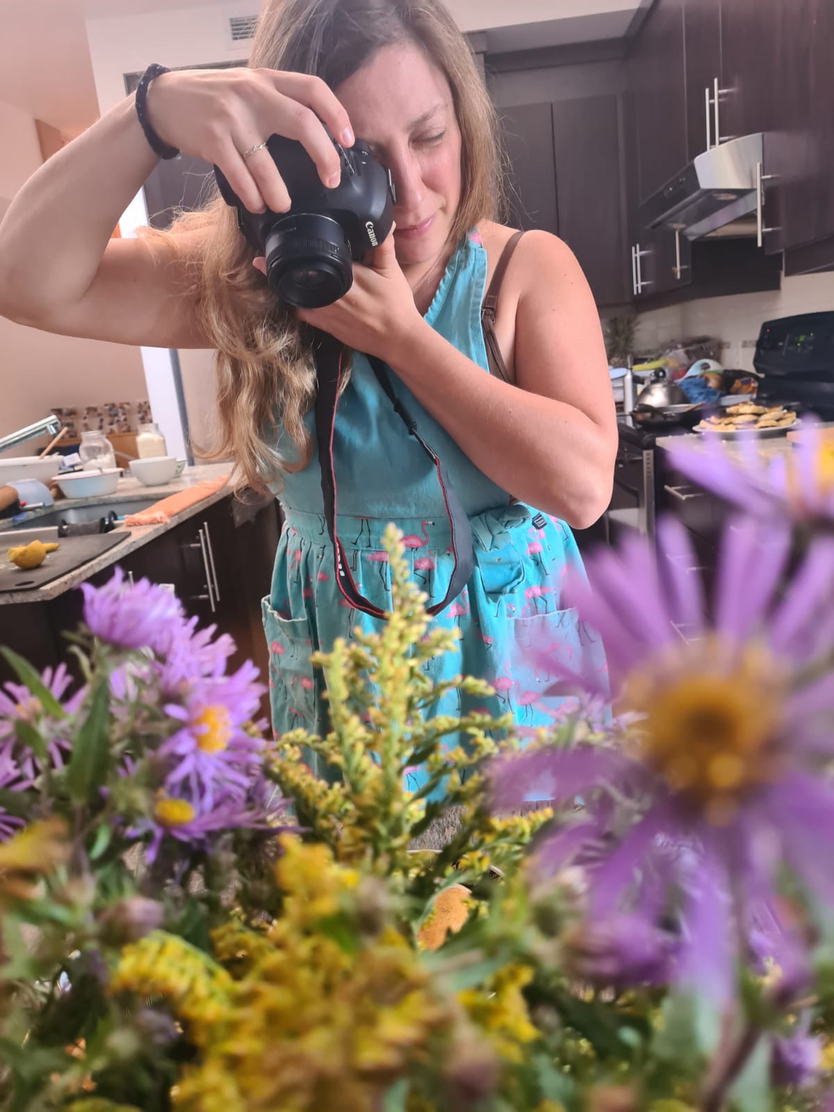 Woman photgraphing flowers