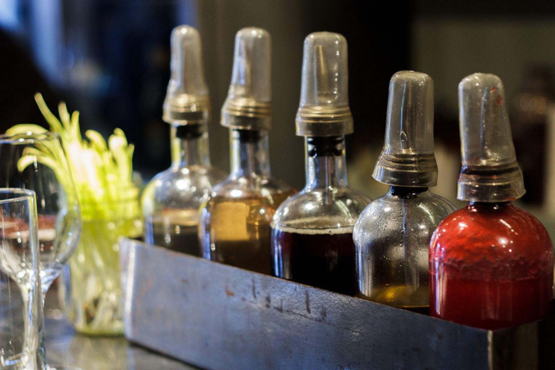 A row of homemade bitters bottles