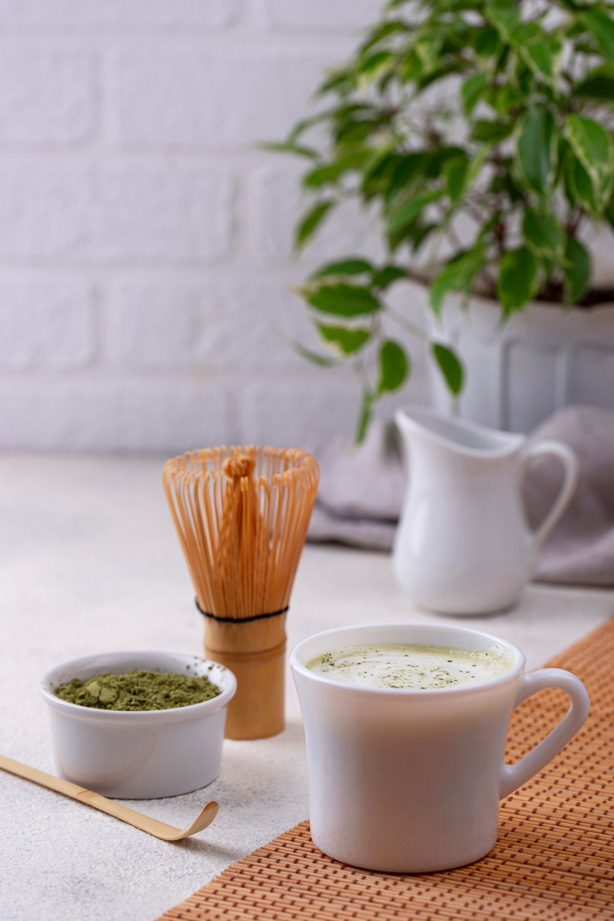 matcha tea, whisk, cup and pitcher.